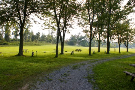 Shaded sites next to the beautiful, open field at Ballyhoo Family Campground.